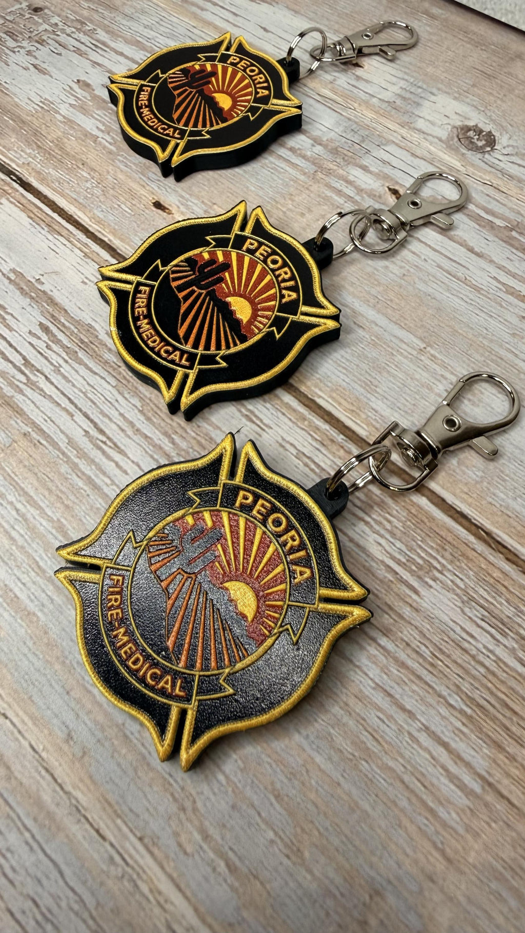 Peoria Fire-Medical Department keychain on wood
