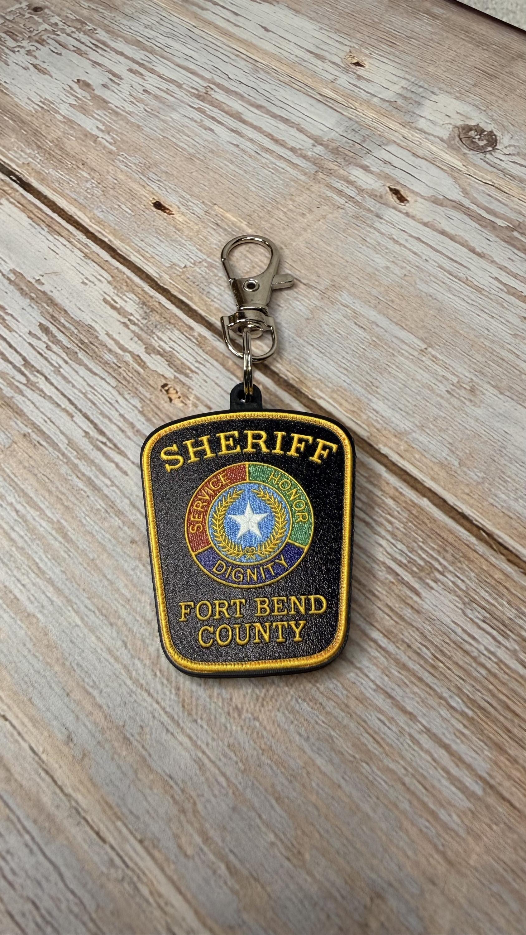 Fort Bend County Sheriff keychain on wood